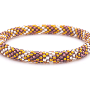 Sashka Co. handmade glass beaded friendship bracelet with amber, plum, and silver glass beads in a chevron pattern. Crafted in Nepal by skilled artisans.