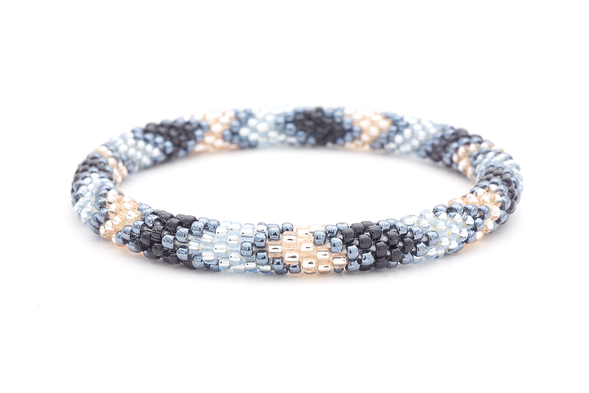 Sashka Co. handmade glass beaded friendship bracelet with black, silver, rose gold, and clear light blue glass beads. Crafted in Nepal by skilled artisans.