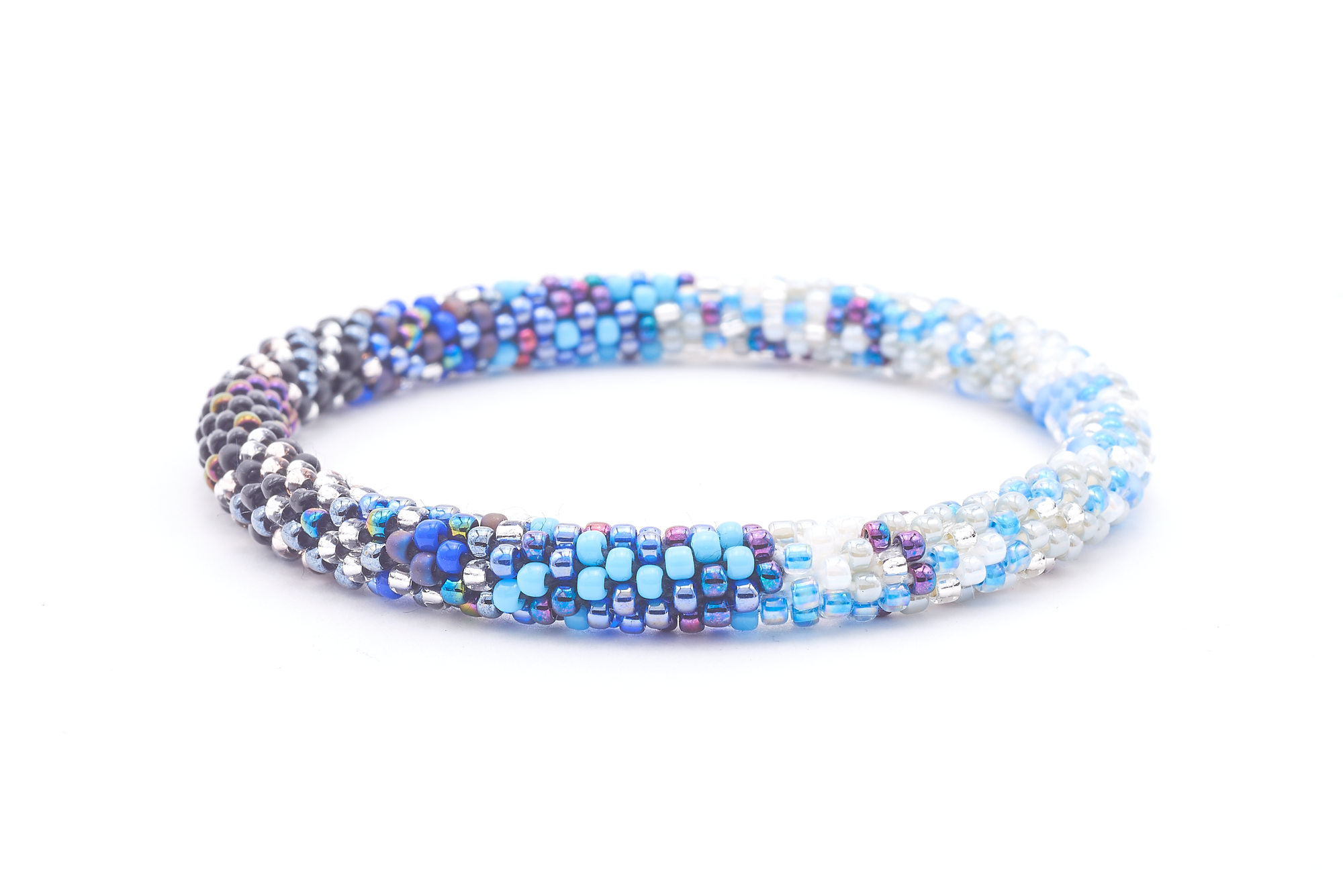 Sashka Co. handmade glass beaded friendship bracelet with black, silver, white, blue, and iridescent purple glass beads in a confetti mixed pattern. Crafted in Nepal by skilled artisans.