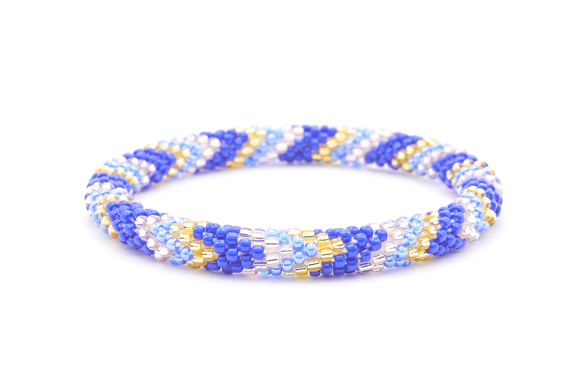 Sashka Co. handmade glass beaded friendship bracelet with blue, champagne gold, and rose gold glass beads. Crafted in Nepal by skilled artisans.