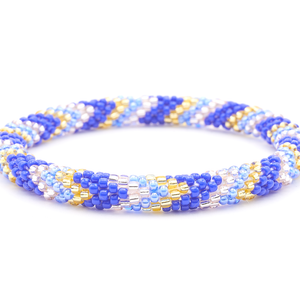 Sashka Co. handmade glass beaded friendship bracelet with blue, champagne gold, and rose gold glass beads. Crafted in Nepal by skilled artisans.