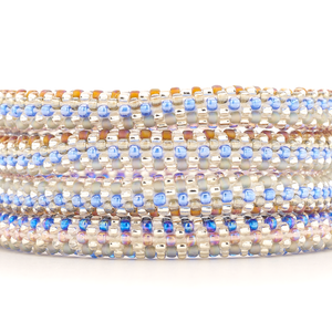 Sashka Co. handmade glass beaded friendship bracelet with blue, clear, silver, brown, and light purple glass beads. Crafted in Nepal by skilled artisans.