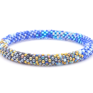 Sashka Co. handmade glass beaded friendship bracelet with blue, iridescent, black, gold, gray, and silver glass beads. Crafted in Nepal by skilled artisans.
