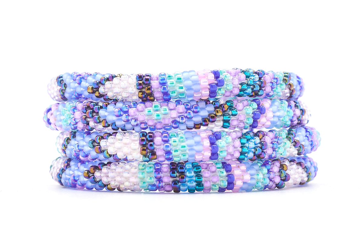 Handmade beaded friendship bracelet with blue, purple, iridescent, and aqua glass beads. Crafted by artisans in Nepal for Sashka Co.

