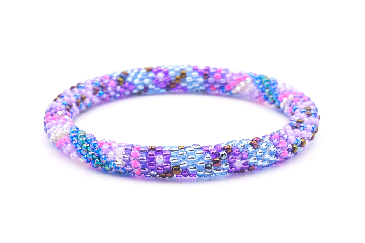 Sashka Co. handmade glass beaded friendship bracelet with shades of blue, purple, pink, iridescent teal, and clear glass beads in a flower mixed pattern. Crafted in Nepal by skilled artisans.