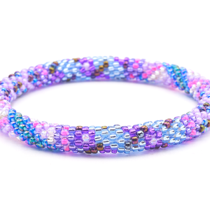 Sashka Co. handmade glass beaded friendship bracelet with shades of blue, purple, pink, iridescent teal, and clear glass beads in a flower mixed pattern. Crafted in Nepal by skilled artisans.