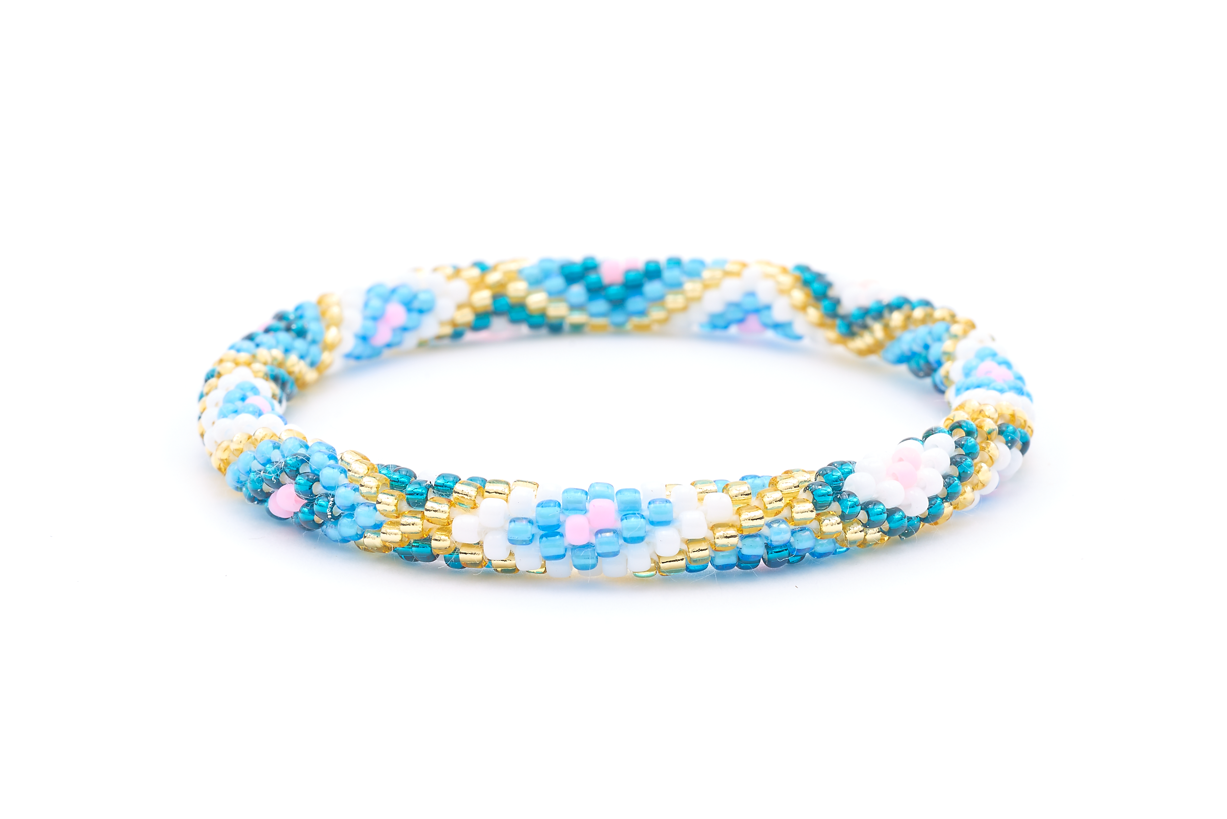 Sashka Co. handmade beaded friendship bracelet with blue, teal, white, champagne gold, and pink glass beads. Crafted in Nepal by skilled artisans in a diamond pattern.