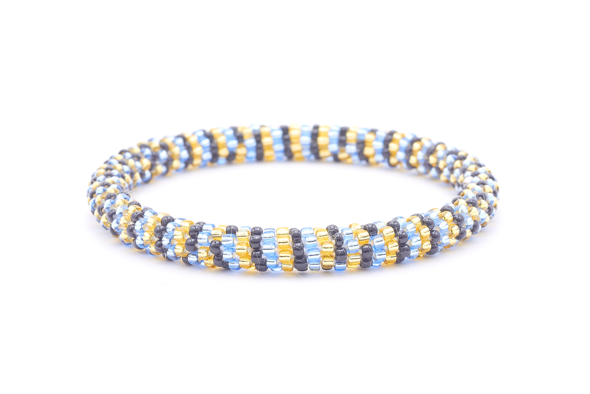 Sashka Co. handmade glass beaded friendship bracelet with champagne gold, light blue, and black glass beads. Crafted in Nepal by skilled artisans.