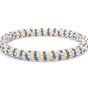 Sashka Co. handmade glass beaded friendship bracelet with champagne gold, light blue, and black glass beads. Crafted in Nepal by skilled artisans.