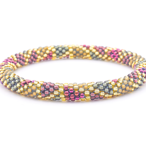 Sashka Co. handmade glass beaded friendship bracelet with champagne gold, plum, matte golden brown, silver, and plum wine glass beads. Crafted in Nepal by skilled artisans.
