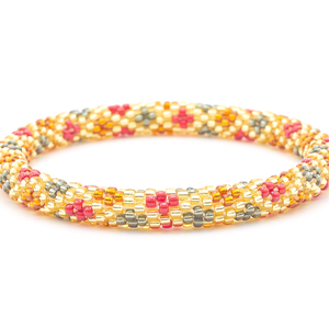 Sashka Co. handmade glass beaded friendship bracelet with champagne gold, red, silver, and bronze glass beads. Crafted in Nepal by skilled artisans.
