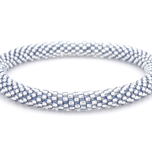 Sashka Co. handmade glass beaded friendship bracelet with clear beads and dark blue thread. Crafted in Nepal by skilled artisans.