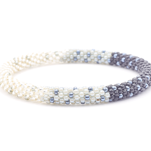 Sashka Co. handmade glass beaded friendship bracelet with clear, gray, silver, and black glass beads. Crafted in Nepal by skilled artisans.