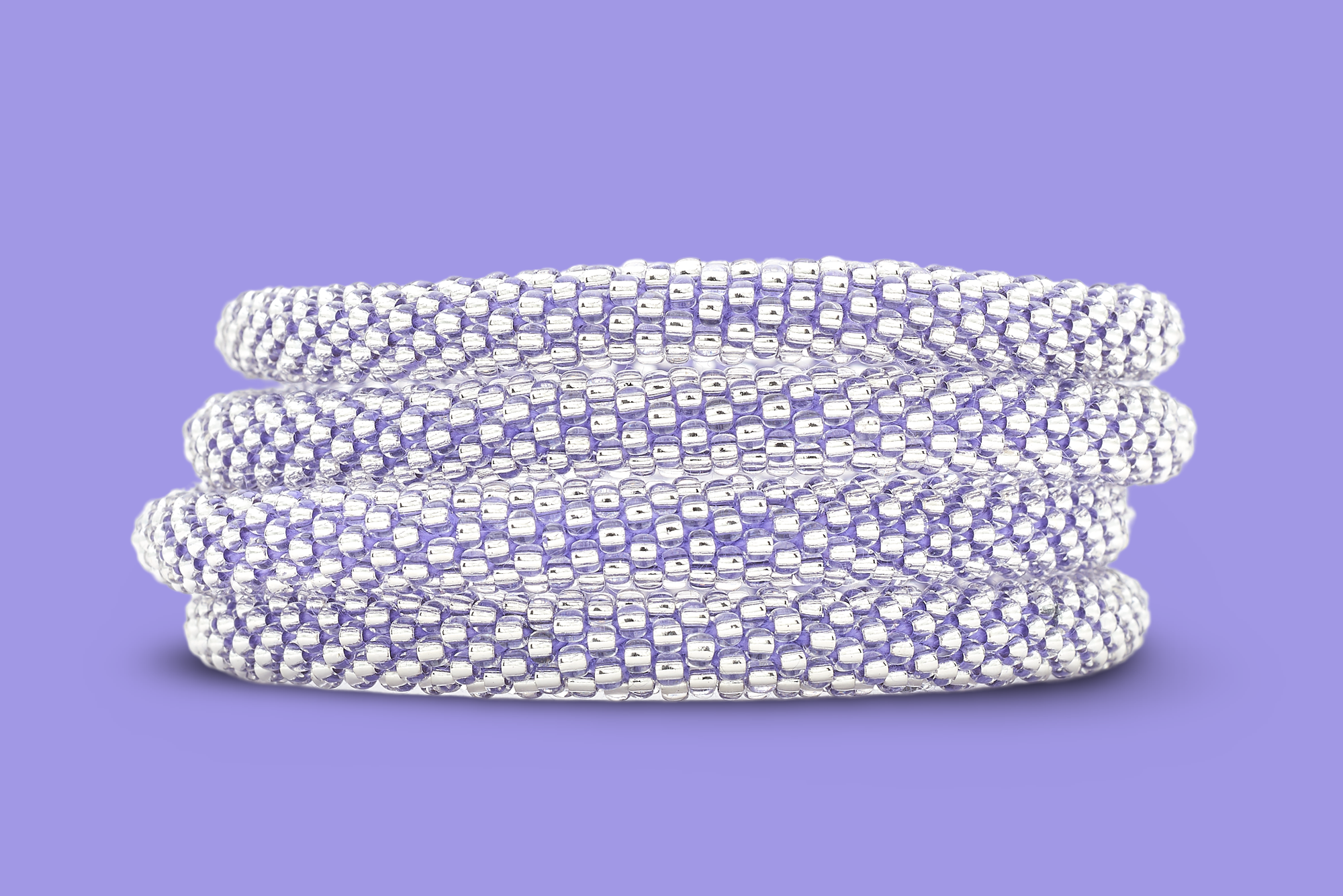 Sashka Co handmade beaded friendship bracelet with clear glass beads and purple thread. Crafted in Nepal by skilled artisans.