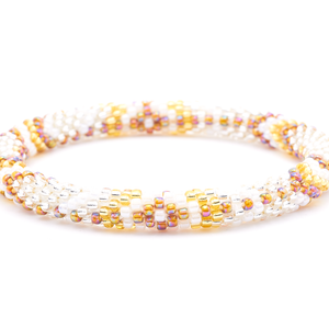 Sashka Co. handmade glass beaded friendship bracelet with clear, white, champagne gold, and iridescent brown glass beads. Crafted in Nepal by skilled artisans.