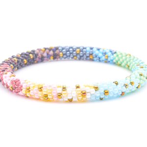 Sashka Co. handmade glass beaded friendship bracelet with green, yellow, blue, white, pink, purple, brown, black, silver, and gold glass beads. Crafted in Nepal by skilled artisans.