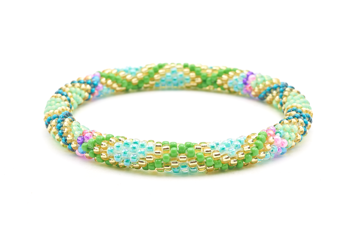 Sashka Co. handmade glass beaded friendship bracelet with green, champagne gold, aqua, pink, purple, and teal glass beads. Crafted in Nepal by skilled artisans.