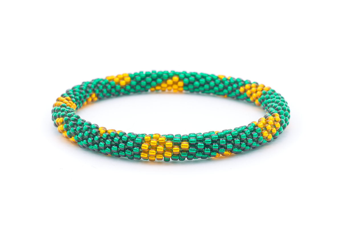 Sashka Co. handmade beaded friendship bracelet with green and gold glass beads. Crafted in Nepal by skilled artisans in a patterned design.
