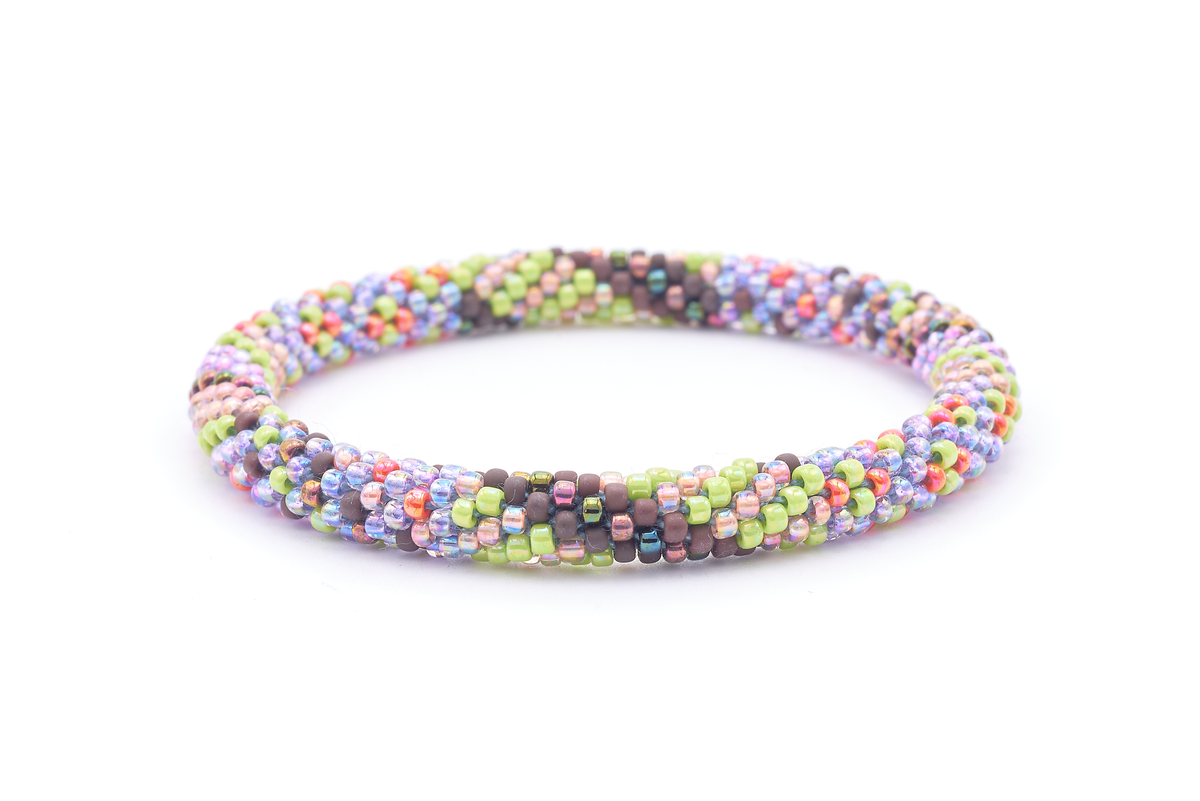 Sashka Co. handmade beaded friendship bracelet with green, iridescent, purple, brown, and orange glass beads. Crafted in Nepal by skilled artisans in a spiral confetti pattern.