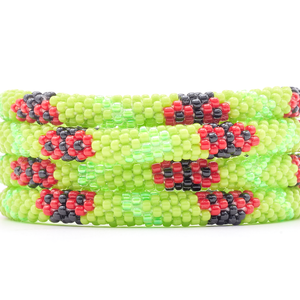 Sashka Co. handmade glass beaded friendship bracelet with green, red, and black glass beads. Crafted in Nepal by skilled artisans.