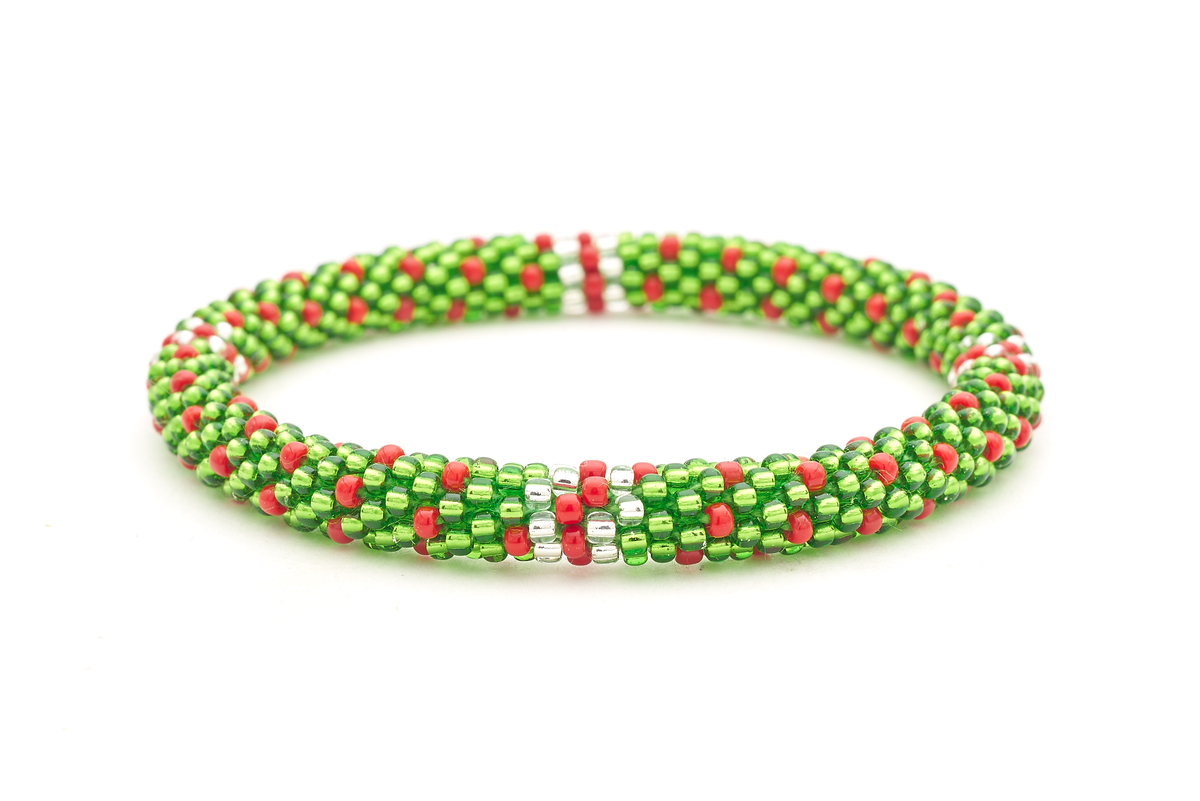 Sashka Co. handmade glass beaded friendship bracelet with green, red, and clear beads in a festive polka dot line pattern. Crafted in Nepal by skilled artisans.