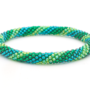 Sashka Co handmade beaded friendship bracelet with green and teal glass beads in a spiral pattern. Crafted in Nepal by skilled artisans.