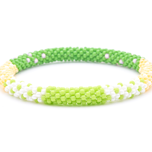 Sashka Co. handmade glass beaded friendship bracelet with green, yellow, white, and pink glass beads. Crafted in Nepal by skilled artisans.