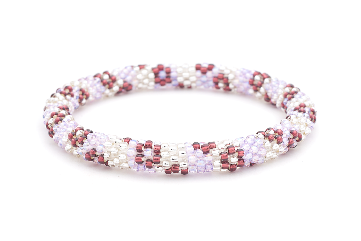Sashka Co. handmade beaded friendship bracelet with iridescent light purple, clear, and plum glass beads in a flower pattern. Crafted in Nepal by skilled artisans.