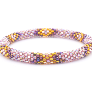 Sashka Co. handmade glass beaded friendship bracelet with iridescent mauve, iridescent purple, and gold glass beads. Crafted in Nepal by skilled artisans.