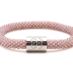 Sashka Co. Iridescent Mauve w/ Silver Best Friend Charm Bracelet. Handmade glass bead bracelet from Nepal, featuring a roll design.