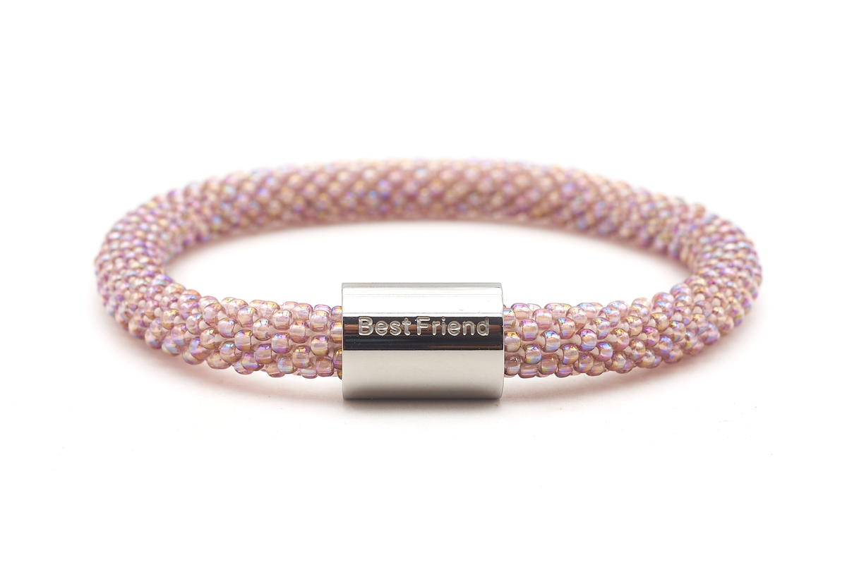 Sashka Co. Iridescent Mauve w/ Silver Best Friend Charm Bracelet. Handmade glass bead bracelet from Nepal, featuring a roll design.
 