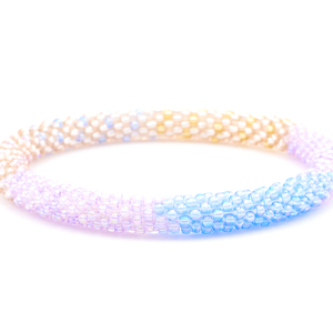 Sashka Co. handmade glass beaded friendship bracelet with lavender, purple, rose gold, and champagne gold glass beads. Crafted in Nepal by skilled artisans.