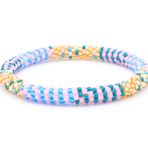 Sashka Co. handmade beaded friendship bracelet with matte light pink, teal, champagne gold, blue, and white glass beads. Crafted in Nepal by skilled artisans in a line pattern.