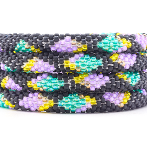 Sashka Co. Matte Black, Purple, Teal, Yellow Bracelet. Handmade glass bead bracelet from Nepal, featuring a roll design.