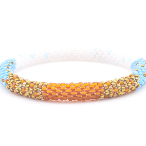 Sashka Co. handmade glass beaded friendship bracelet with matte brown, bronze, iridescent blue, and white glass beads. Crafted in Nepal by skilled artisans.