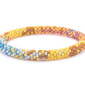 Sashka Co. handmade glass beaded friendship bracelet with matte brown, matte yellow, yellow, gray, and iridescent clear, pink, orange, and purple glass beads in a mixed pattern. Crafted in Nepal by skilled artisans.