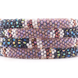 Sashka Co. handmade glass beaded friendship bracelet with matte iridescent purple, black, iridescent, clear, and iridescent plum glass beads. Crafted in Nepal by skilled artisans.