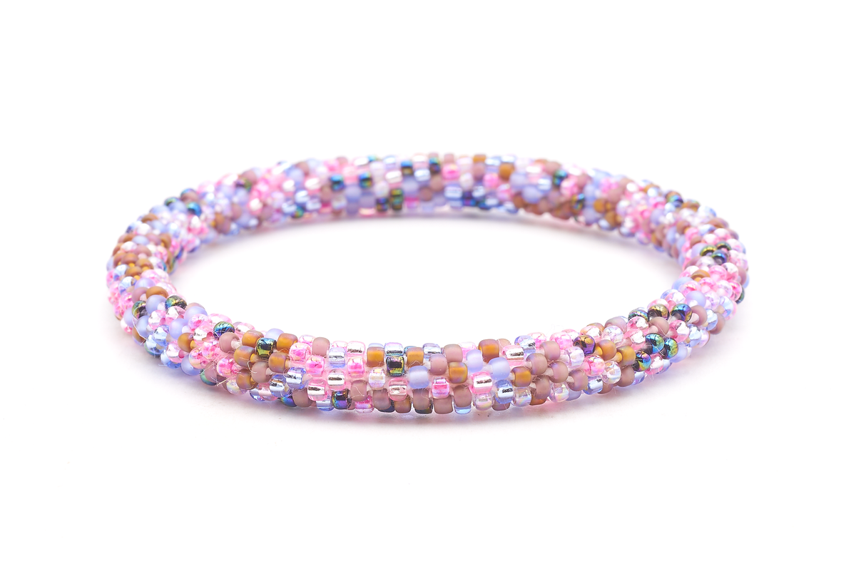Sashka Co. handmade glass beaded friendship bracelet with matte periwinkle, matte brown, clear, pink, iridescent, and blue glass beads in a confetti pattern. Crafted in Nepal by skilled artisans.