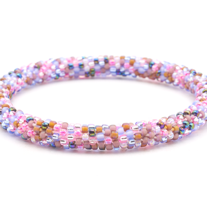 Sashka Co. handmade glass beaded friendship bracelet with matte periwinkle, matte brown, clear, pink, iridescent, and blue glass beads in a confetti pattern. Crafted in Nepal by skilled artisans.