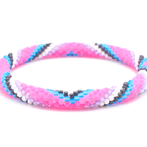 Sashka Co. Matte Pink, Purple, White, Black, Matte Blue Bracelet. Handmade glass bead bracelet from Nepal, featuring a roll design.
 