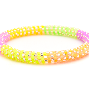 Handmade beaded friendship bracelet with neon yellow, green, orange, pink, purple, and rose gold glass beads. Crafted by artisans in Nepal for Sashka Co.