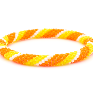 Sashka Co. handmade beaded friendship bracelet with orange, yellow, and white glass beads. Crafted in Nepal by skilled artisans in a spiral pattern.