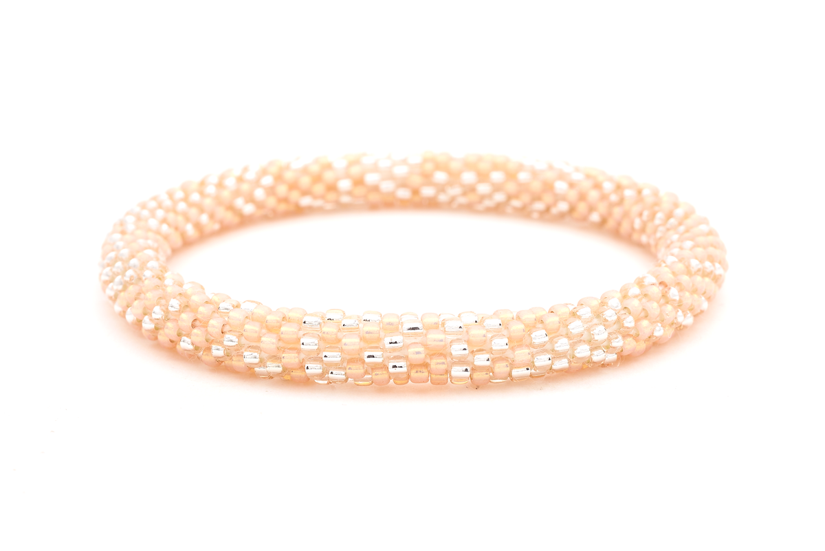 Sashka Co. handmade glass beaded friendship bracelet with peach and clear glass beads. Crafted in Nepal by skilled artisans.