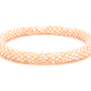 Sashka Co. handmade glass beaded friendship bracelet with peach and clear glass beads. Crafted in Nepal by skilled artisans.