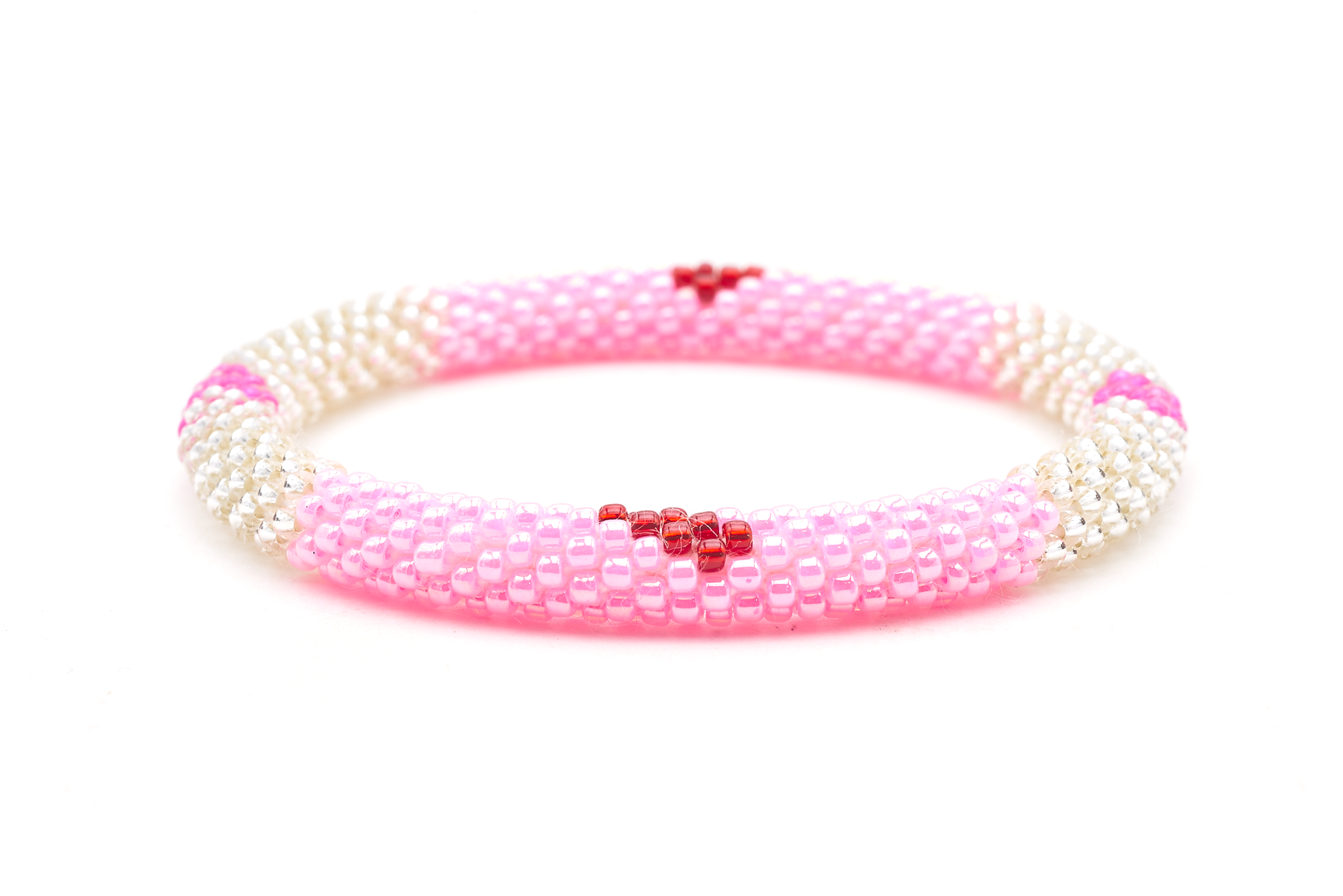 Sashka Co. handmade glass beaded friendship bracelet with pink, clear, and red glass beads in a block heart pattern. Crafted in Nepal by skilled artisans.