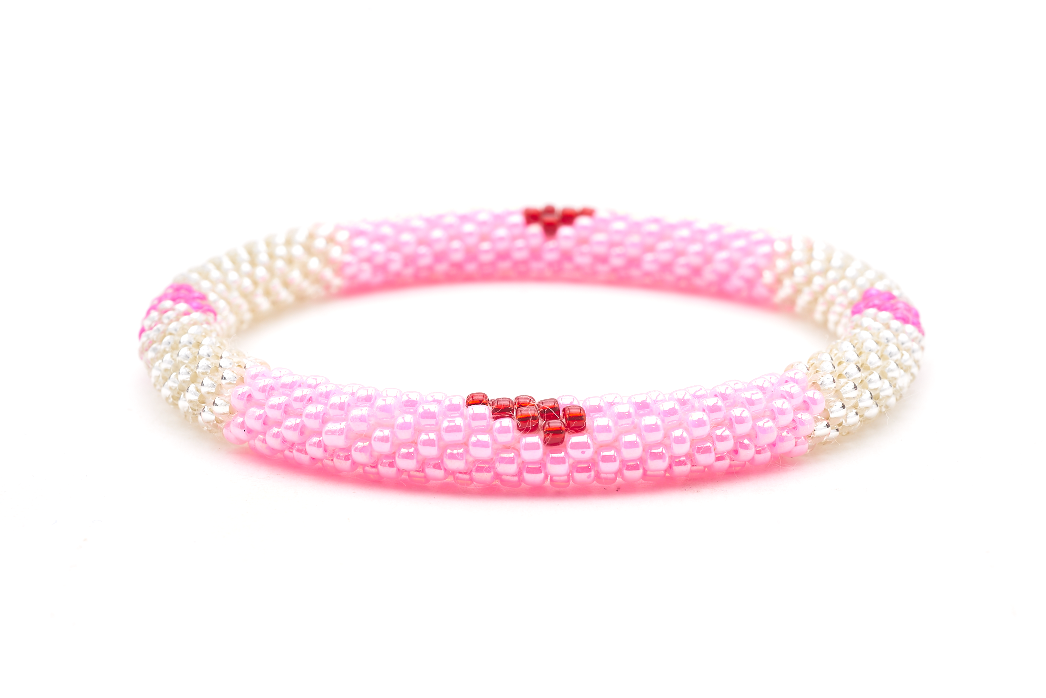 Sashka Co. handmade glass beaded friendship bracelet with pink, clear, and red glass beads in a block heart pattern. Crafted in Nepal by skilled artisans.