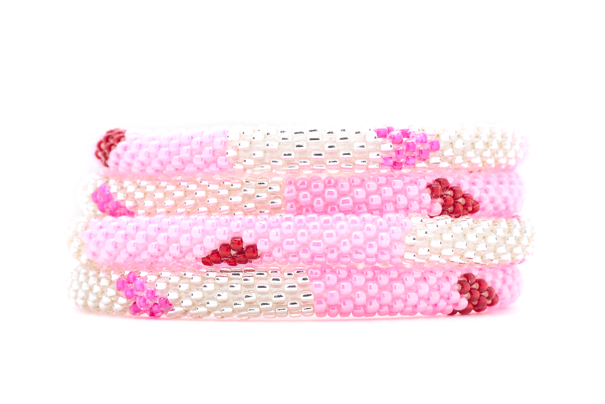 Sashka Co. handmade glass beaded friendship bracelet with pink, clear, and red glass beads in a block heart pattern. Crafted in Nepal by skilled artisans.