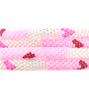 Sashka Co. handmade glass beaded friendship bracelet with pink, clear, and red glass beads in a block heart pattern. Crafted in Nepal by skilled artisans.