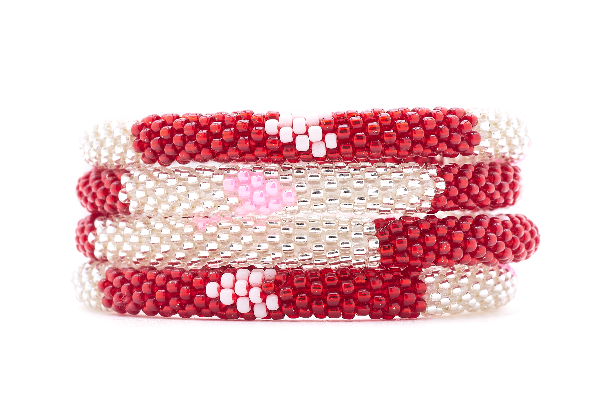 Sashka Co. handmade glass beaded friendship bracelet with pink, clear, white and red glass beads in a block heart pattern. Crafted in Nepal by skilled artisans.