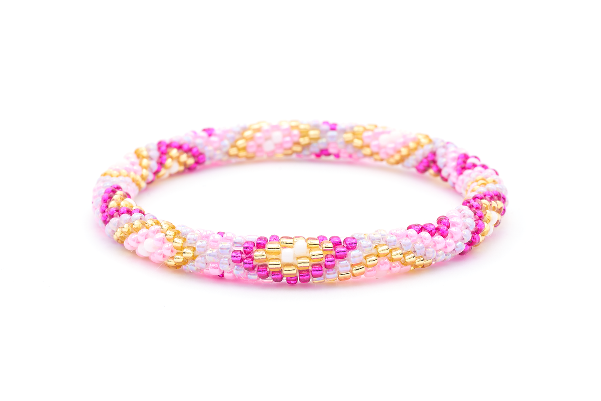 Sashka Co. handmade beaded friendship bracelet with pink, fuchsia, champagne gold, purple, and white glass beads. Crafted in Nepal by skilled artisans in a diamond pattern.